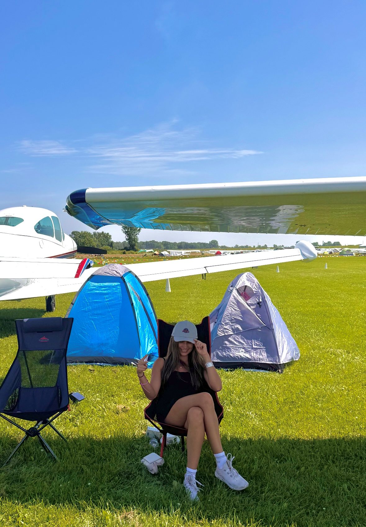 Camping in a tent under an aircraft wing at EAA Oshkosh